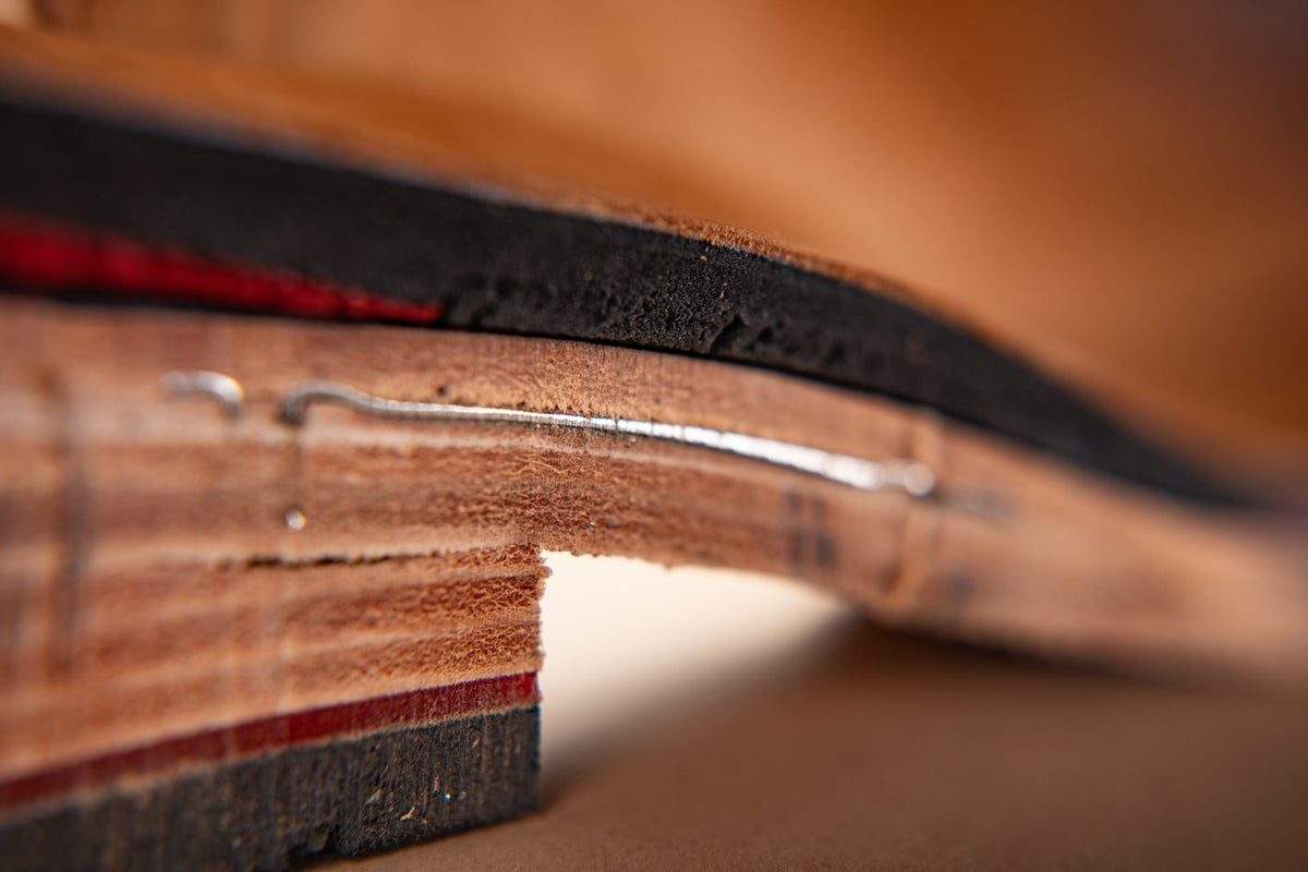 The thick leather sole under the waist of the boot